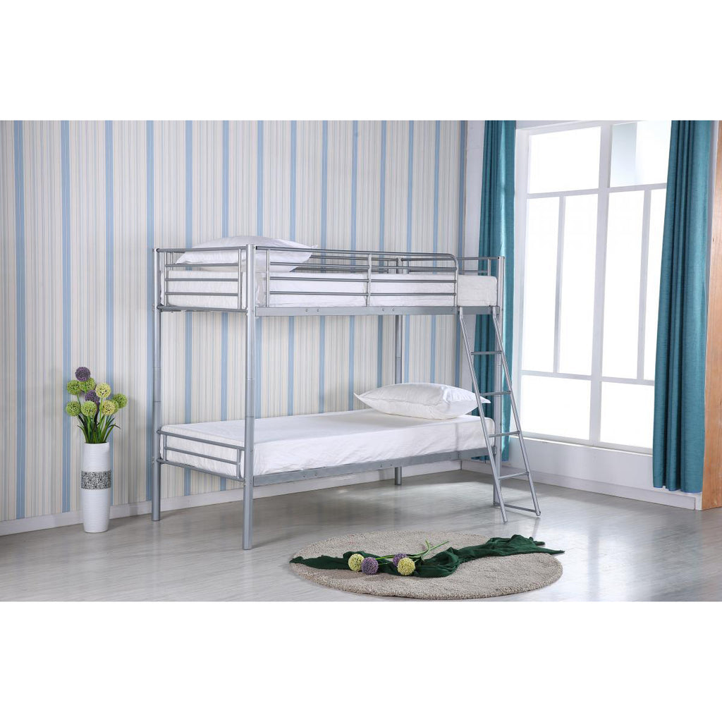 Picture of metal bunk bed in a room with striped wallpaper and a window.