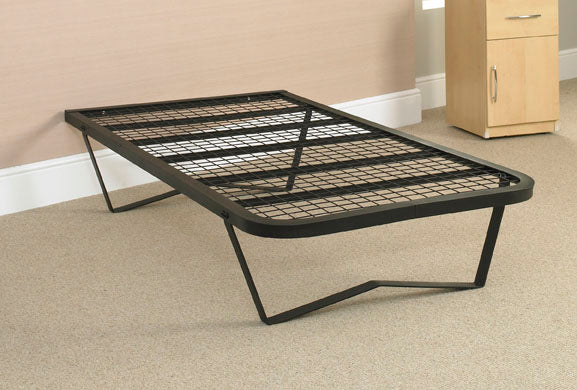 Black metal bed frame on a skids against beige carpeted floor with a wooden cabinet in the background.