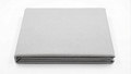 Picture of a light grey bedding on a white background. 