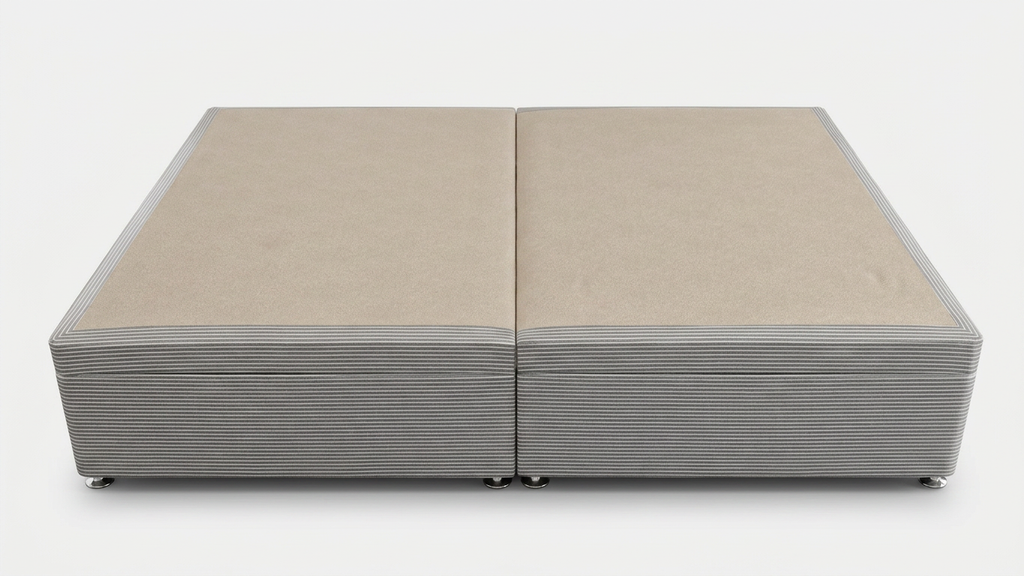 Double ottoman bed base with a ribbed texture on a white background from a side on perspective