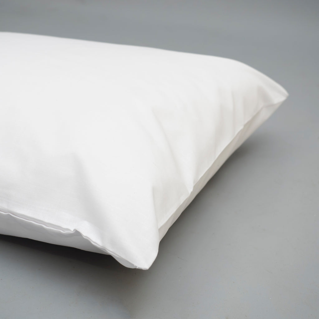 Picture of a cream pillowcase on a pillow