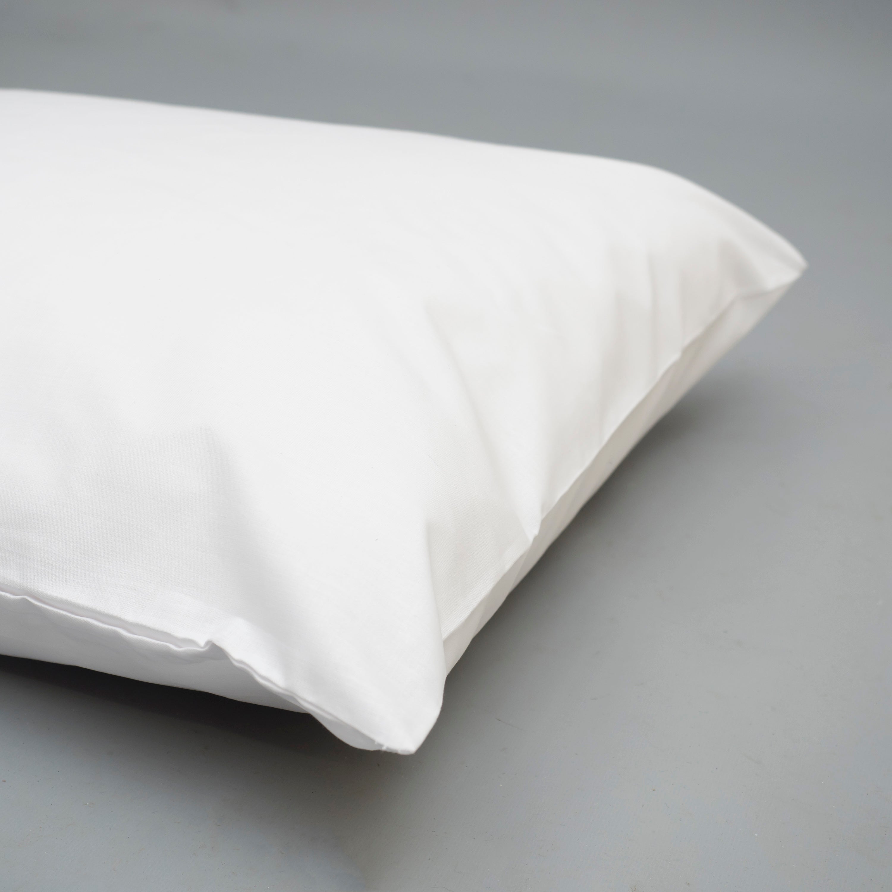 Picture of a cream pillowcase on a pillow