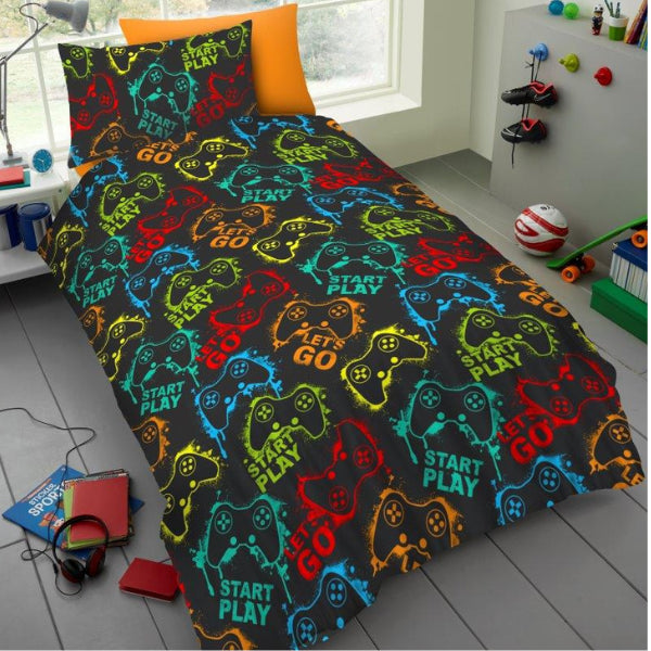 Picture of bedding with images of gaming controllers and the phrases Start Play and Let's Go written on it
