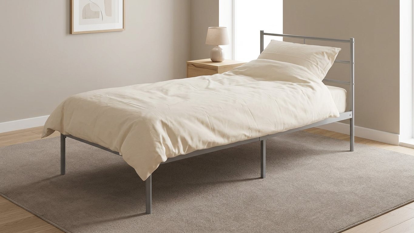 Bedroom with a metal bed frame, mattress, cream bedding.